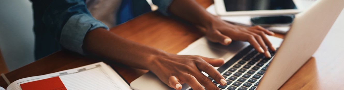 hands typing on a keyboard