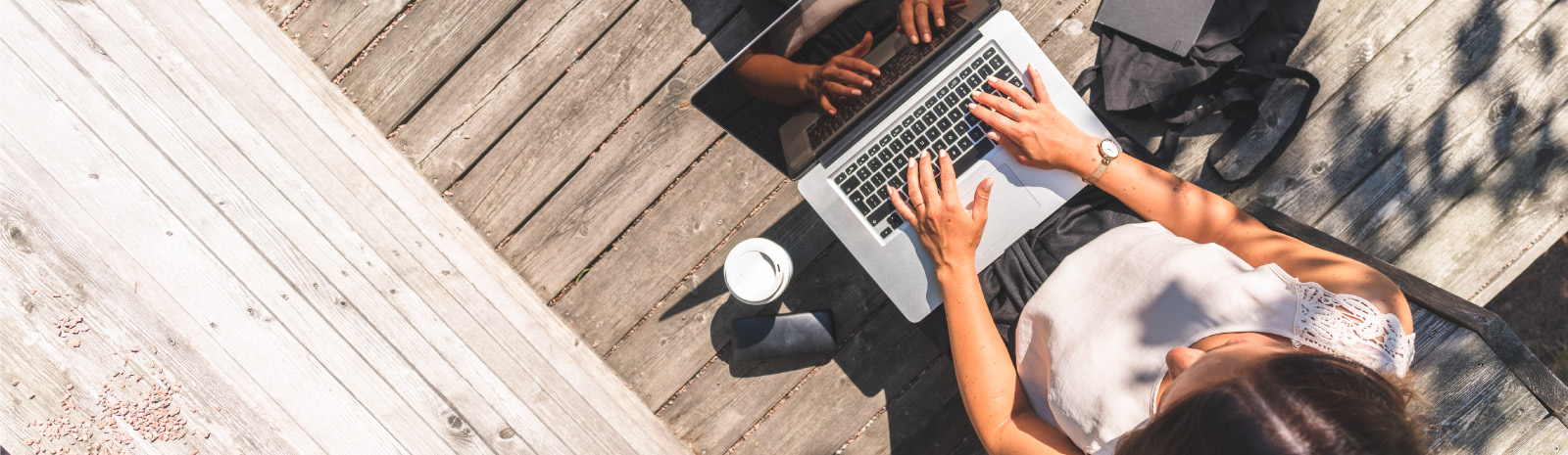 a woman on her laptop outside