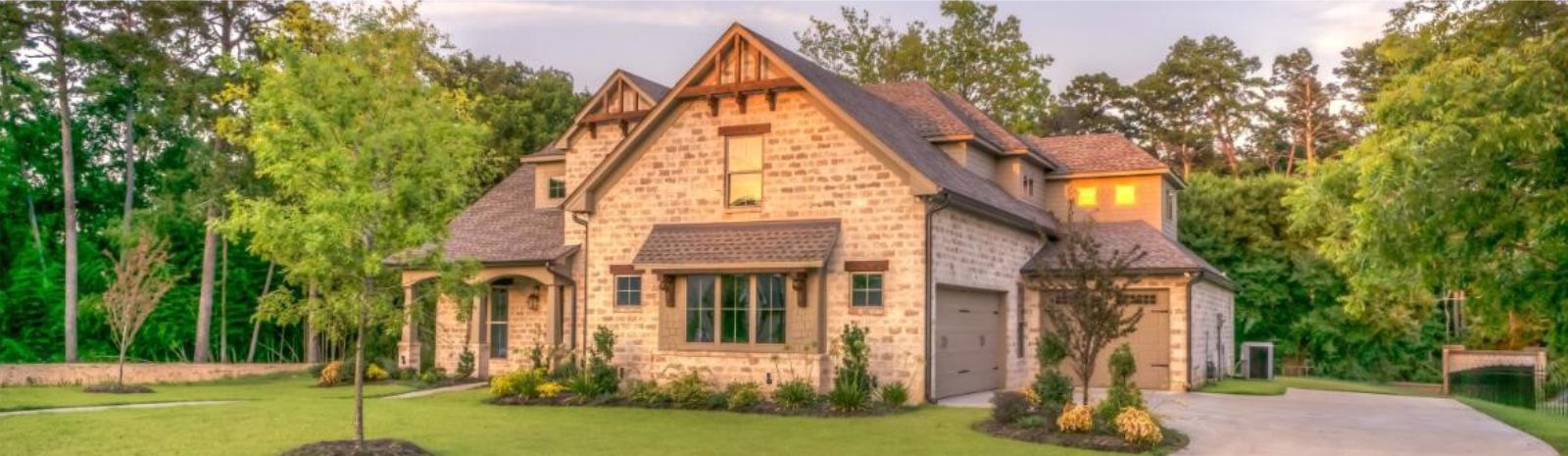 a tan two-story brick house